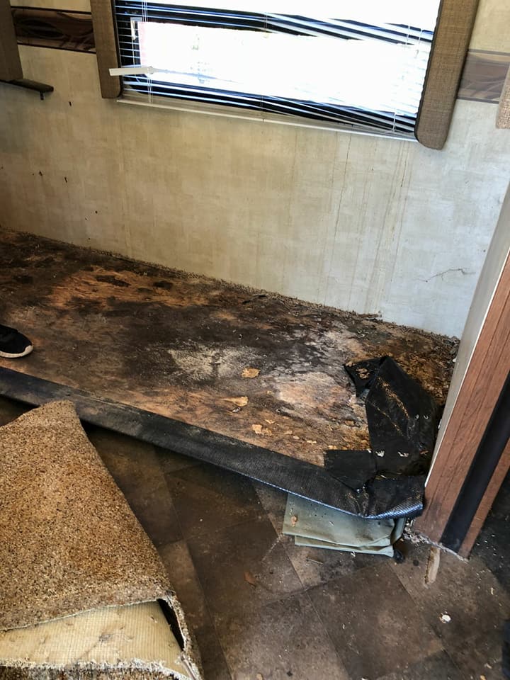 Water-damaged RV subfloor before repair