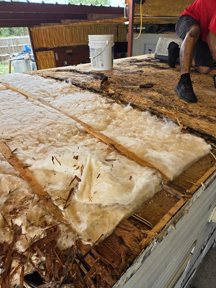 Roof torn down to insulation